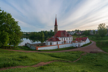 Priory Palace on the shore of the Black Lake on an summer sunny morning, Gatchina, St. Petersburg, Russia