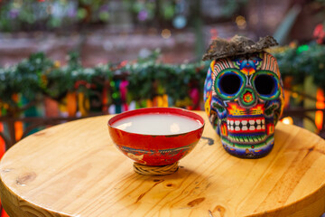 Traditional Mexican pulque drink with a skull of dia de muertos