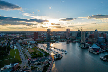 Aerial Drone View of Baltimore City Inner Harbor before Sunset with Blue Skies