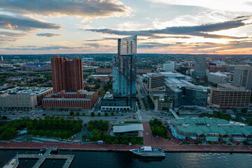 Fototapeta premium Aerial Drone View of Baltimore City Inner Harbor before Sunset with Blue Skies