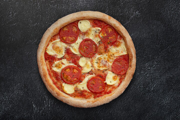 margarita pizza on black background