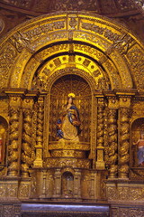 Fototapeta na wymiar Shrine in the Church of la Compania de Jesus, or the Gold Church, in the Old Town Quito, Ecuador