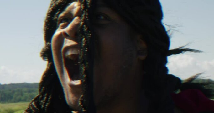Samson powerfully roaring and looking around in confrontatiion, Biblical character with long dreads, Israelite warrior and judge, black male in old testament, Christian