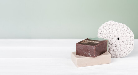 organic hand made solid soap bars and knit cotton washcloth on a table. natural hygiene product. eco friendly spa, beauty skincare. Small business, ethical shopping