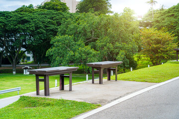 Two chairs on green grass at Park,vivid tone  in nature forest Mountain views spring cloudy sky background with white cloud.