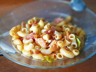 macaroni with pork ham on the transparent plate