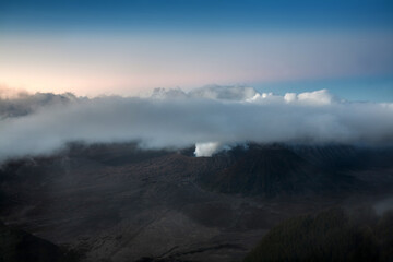 Fototapeta na wymiar Bromo Mountain with Morning Mist, is Volcano Mountain in Surabaya, Indonesia