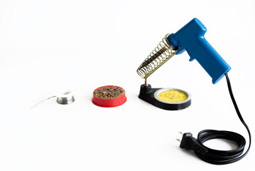 Soldering iron gun or electric solder with lead solder and Soldering liquid for soldering electronic work or repair electronic isolated on white background. Selective focus.