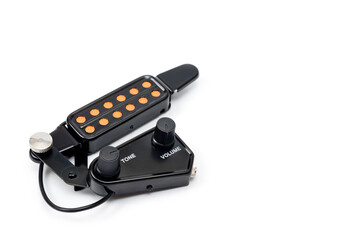 Magnetic pickup with tone and volume control for acoustic guitar.
