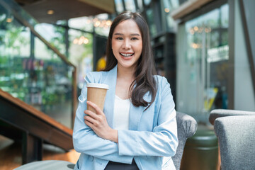 portrait leisure attractive smart asian female freelance entrepreneur smile and enjoy working with smartphone and tablet at cafe restaurant expat digital nomad casual working distance ideas concept