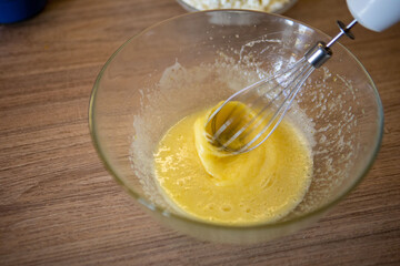 mixing eggs in bowl close up