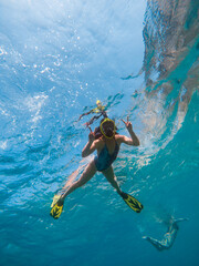 beautiful woman swimming underwater with snorkeling mask and flippers - obrazy, fototapety, plakaty