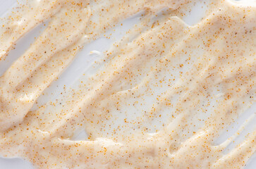 Cosmetic cream scrub for face or body. Textured background