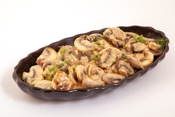 Cooked mushrooms in butter in plate