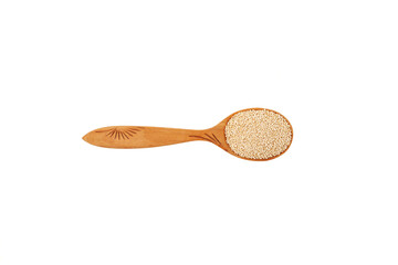 White Quinoa seeds in wooden spoon on white background. Top view. Design element