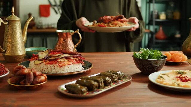 Kabsa, maqluba, dolma, tabbouleh close-up, rice and meat dish, middle eastern national traditional food. Muslim family dinner, Ramadan, iftar. Arabian cuisine.