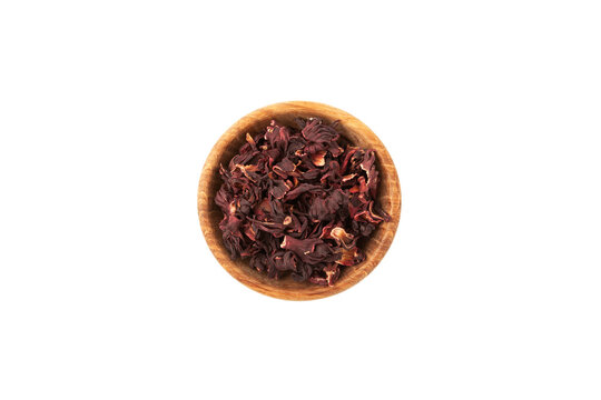Dried hibiscus petals or Hibiscus sabdariffa in wooden bowl, top view. Karkade petals used to make herbal tea and delicious infusion