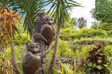 Sagbayan, Bohol - A statue of two tarsiers hanging on a branch welcomes travelers to Captain's Peak...