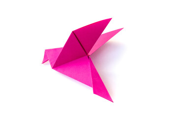 Pink paper dove origami isolated on a white background