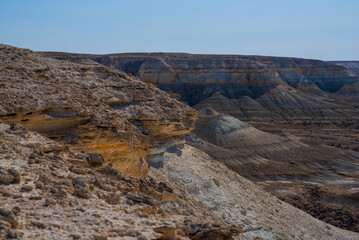 The amazing desert landscape background. Beautiful landscape of desert mountains. Monolithic mountains in desert. Stones and the sky. Bizarre sandstone cliffs in the desert.