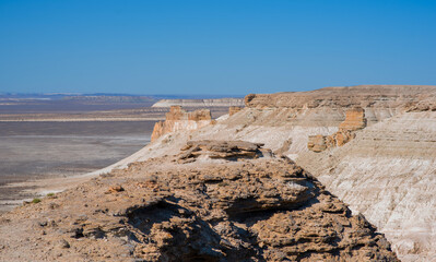 The amazing desert landscape background. Beautiful landscape of desert mountains. Monolithic mountains in desert. Stones and the sky. Bizarre sandstone cliffs in the desert.