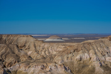 The amazing desert landscape background. Beautiful landscape of desert mountains. Monolithic mountains in desert. Stones and the sky. Bizarre sandstone cliffs in the desert.