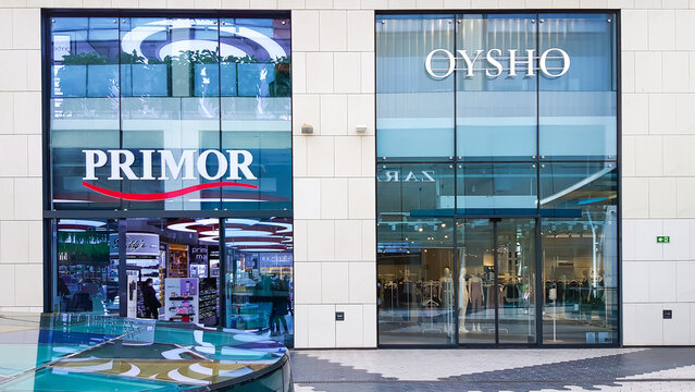 SPAIN, BARCELONA, MARCH, 2022: Glass showcases of Oysho and Primor stores in shopping mall, Barcelona. Spain.