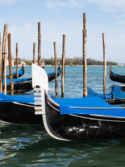 Fototapeta na wymiar Gondola's moored up and waiting for passengers in Venice, Italy