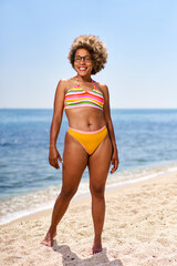 Happy woman with afro hairstyle on the sea .Vacation by the sea