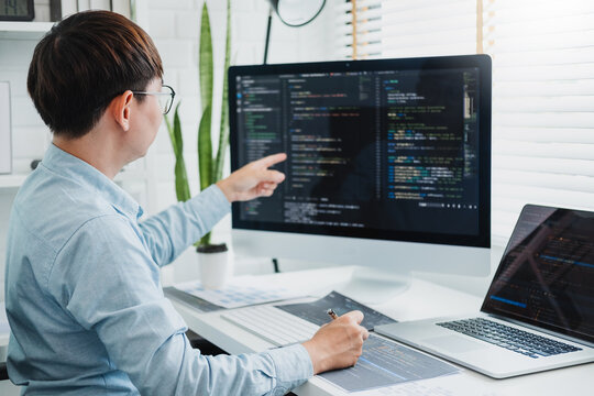 Developing programmer Development Website design and coding technologies working in software company office