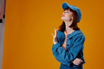 Beautiful fashionable girl denim cap red lips glamor fashion color background unaltered