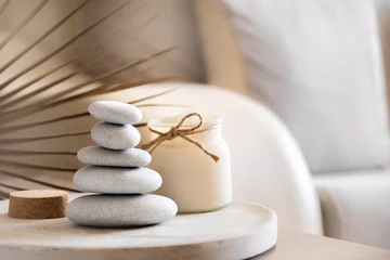 Peel and stick wall murals Spa Sea stones balance and candle on wooden table, spa and relax concept, space for text, selective focus horizontal banner