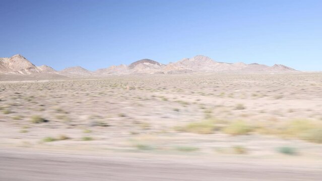 View Out Car Window of Fast Moving Nevada Desert on I-95 between Las Vegas and Reno Nevada