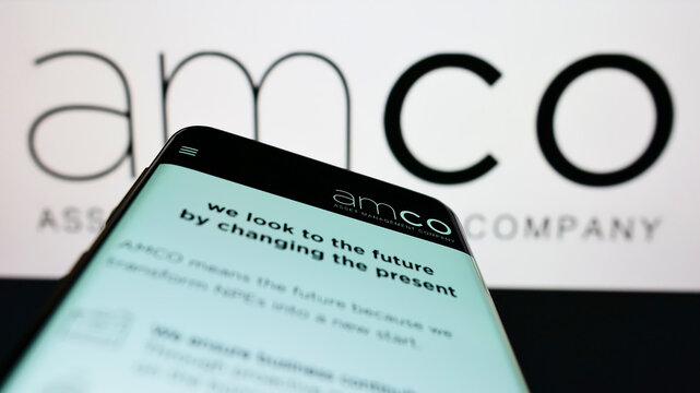 Stuttgart, Germany - 06-11-2022: Mobile phone with website of Italian asset management company AMCO SpA on screen in front of business logo. Focus on top-left of phone display.