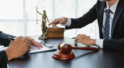 Lawyer or judge advising client's trial at attorney's office, litigation counseling ideas with...