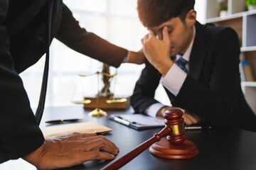 A lawyer or judge is encouraging. In a client's courtroom at a lawyer's office, litigation...