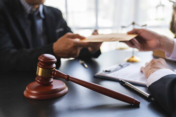 lawyer or judge is taking a bribe. In the client's courtroom at the lawyer's office In order to bribe to gain an advantage in the form of lawsuits, the concept of bribery and corruption in law