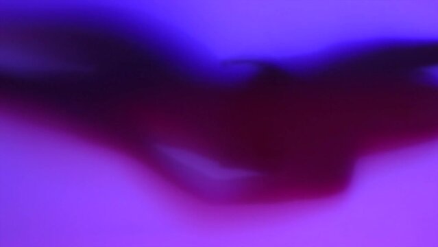 Beauty Model girl dancing shadow silhouette. Beautiful sexy young woman perfect slim body dance in uv colorful light. Seduction. Slow motion 4K UHD. Live background for smartphone