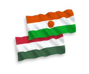 Flags of Republic of the Niger and Hungary on a white background