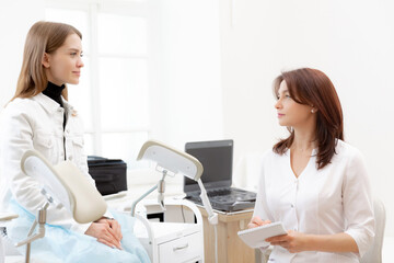 Consultation gynecologist young female patient during medical in modern clinic