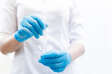 Gynecologist in blue gloves is taking smear analysis for research detect sexually transmitted...