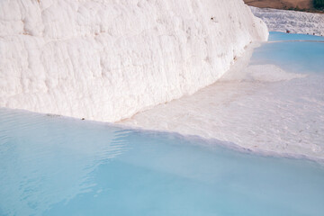 Natural travertine pools pool blue water and terraces in Pamukkale Turkey banner