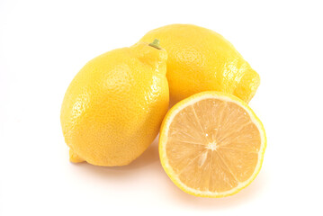 Fresh organic yellow lemon fruit with cut in half isolated on white background