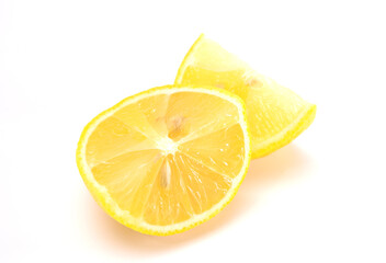 Fresh organic yellow lemon fruit with cut in half isolated on white background