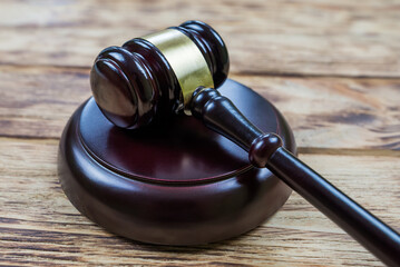 judge's gavel on a wooden background.