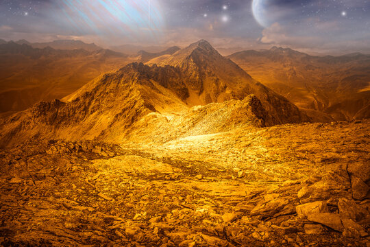 Alien golden landscape, with surface of another planet with ice and sky full of stars. Photo montage that recreates an alien extraterrestrial planet landscape