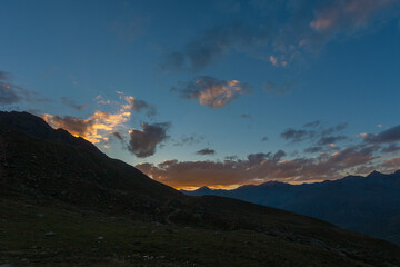 Sunset panorama of the Switzerland Italian border towrds the Engadina region. Vallelunga, Alto Adige, Italy