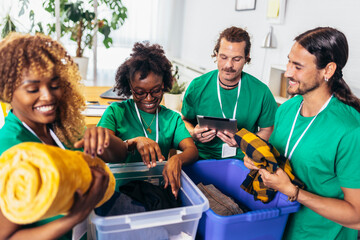 Volunteers putting clothes in donation boxes, social worker making notes charity