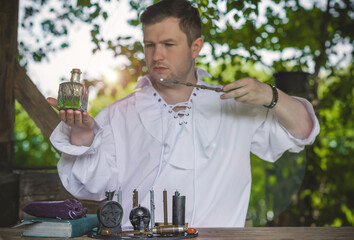 Man wizard with magical stuff. Halloween concept, masquerade or cosplay Medieval men's look