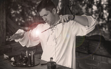 Man wizard with magical stuff. Halloween concept, masquerade or cosplay Medieval men's look